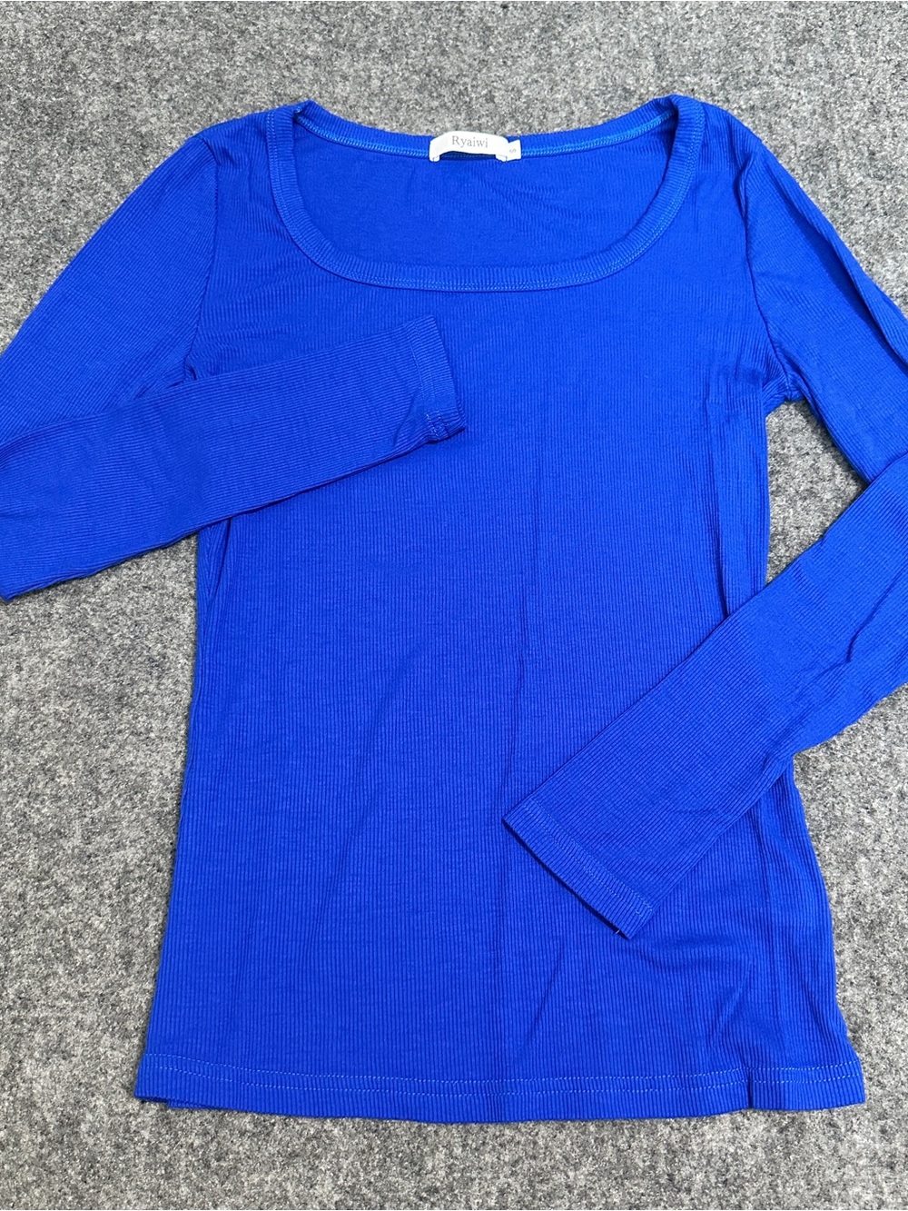 This item is a royal blue ribbed knit long-sleeve top featuring wide scoop neck